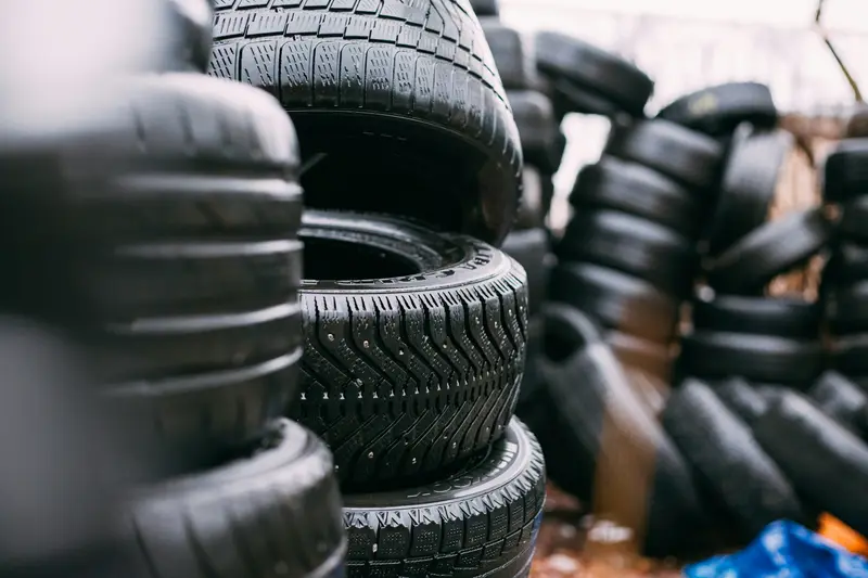 Stacks of used and new car tyres ready for fitting